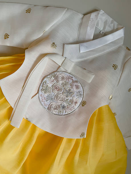 istock Hanbok with white jeogori and yellow skirt 2233683674