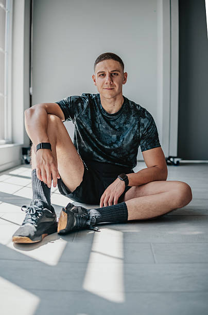 istock Fit athletic man sitting on gym floor, showcasing a healthy lifestyle and commitment to fitness training indoors 2233684882