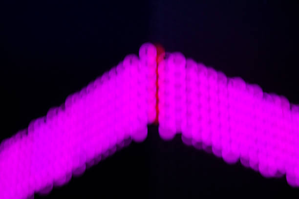 Blurred pink neon lights at facade