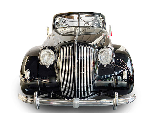 istock A 1930s vintage black car, with a chrome grille and wire wheels, displayed at an angle in a neutral background The photograph focuses on the cars details without distractions 2233687777