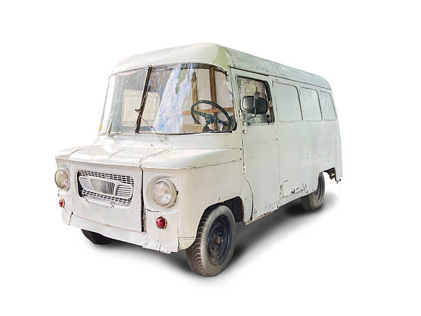 istock A vintage light bluegrey van mid-20th century design with two doors, parked against a plain background on an overcast day The vehicle exhibits minor age signs and classic tire tread No texts or 2233687950