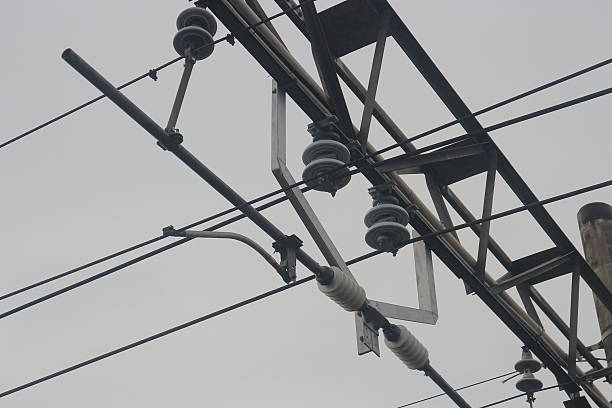 istock Overhead Railway Electrification System: Close-up of Complex Steel Structure and Insulators 2233688320