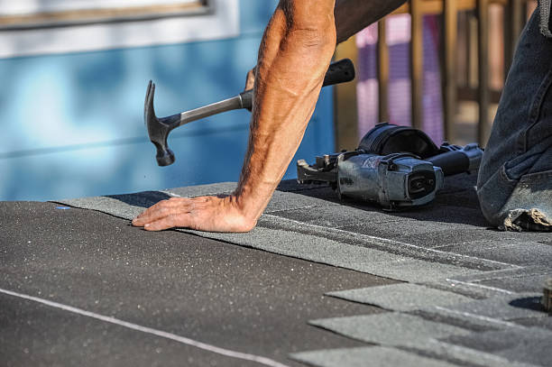 istock handyman working on repair the damaged roof 2233692721