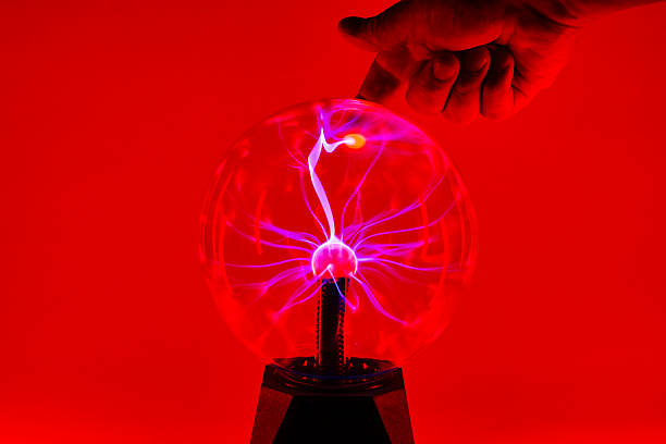 istock Colorful Plasma Energy Ball with Hand Touching Sphere 2233693694