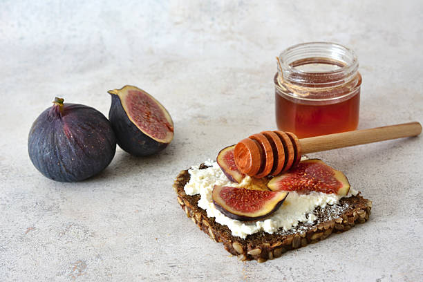 istock Fig and Honey Toast with curd cheese on gray background 2233694881