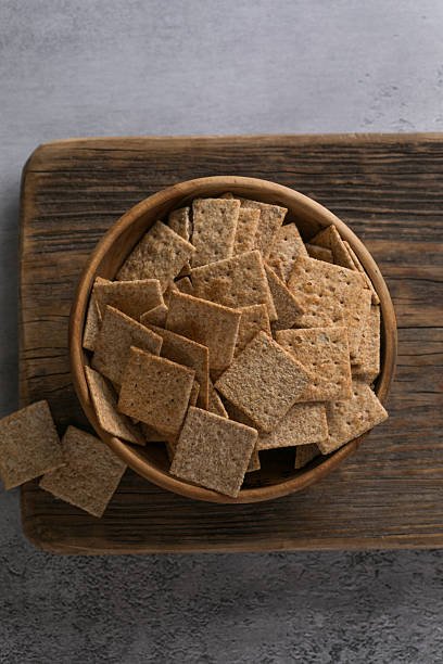 istock Crackers and Crispbreads in Wooden Bowl 2233696296