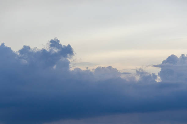 Stormy, ominous sky with dark blue and gray clouds. A dramatic, cloudy background for weather, nature, or environmental themes.