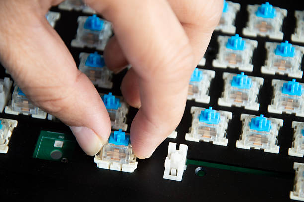 istock Top view of the replaceable keyboard keycaps. Keyboard repair technician. 2233699218