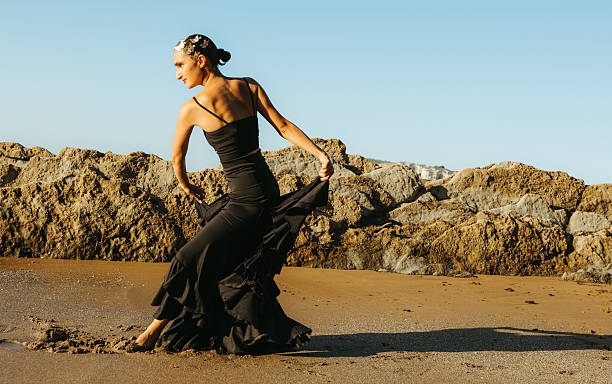 istock Flamenco dancer performing on the beach during golden hour 2233701153
