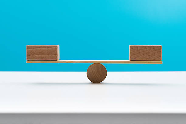 Blank blocks on wooden seesaw