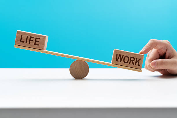 istock Wooden seesaw with word life and work 2233706000