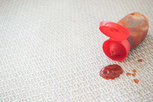 istock Ketchup bottle spills on textured surface in a messy situation 2233707315