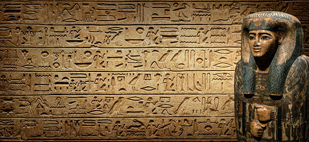 Sarcophagus with an Egyptian mummy on old Egyptian hieroglyphs. Ancient Egyptian hieroglyphs as a symbol of the history of the Earth. Ancient historical background.