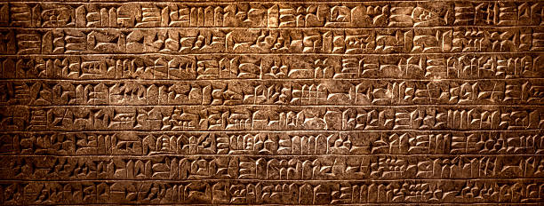 istock Ancient cuneiform Sumerian text. Historical background on the theme of civilizations of Assyria, Mesopotamia, Babylon, interfluve, Sumerian. Ancient archaeological background. 2233708155