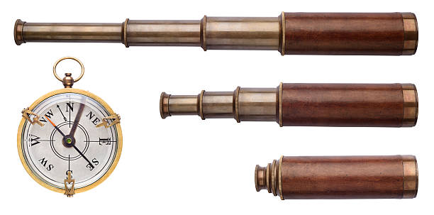 istock Old telescope, telescope tube, telescope pipe and compass isolated on white. Excellent objects on the theme of pirates, sea adventures, travel, etc. 2233710626