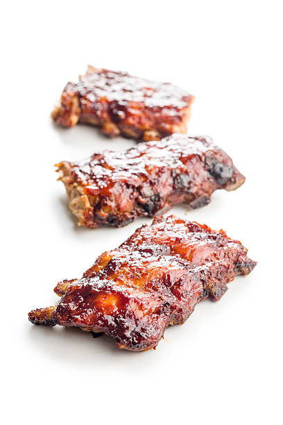 istock Pork BBQ glazed ribs isolated on white background. 2233714286