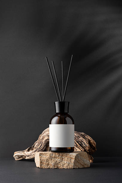 istock Brown glass aroma diffuser with reeds sticks and driftwood 2233715899
