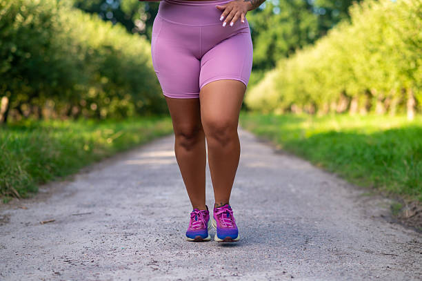 istock Unrecognizable female athlete in workout clothes jogging 2233716200