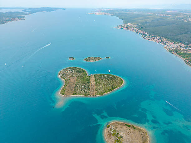 istock Heart Shaped Island in Clear Blue Water 2233719471