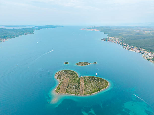 istock Heart Shaped Island in Clear Blue Water 2233719472