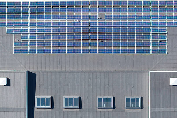 Aerial view of the roof of a school building with a solar panel installation.