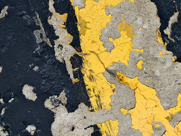 istock Stone texture aged black yellow -colored paint on concrete. 2233722136
