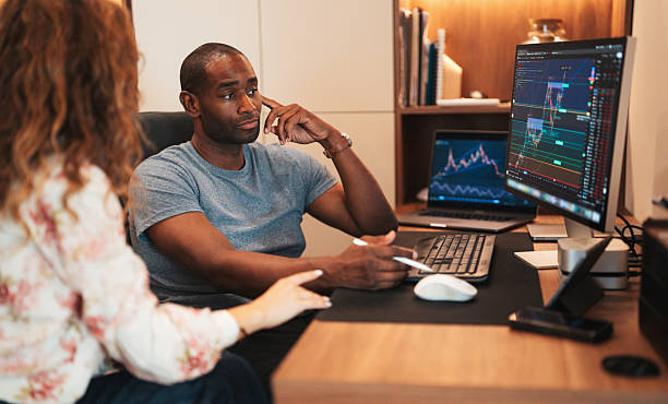 istock Financial analysts discussing cryptocurrency market trends 2233723994