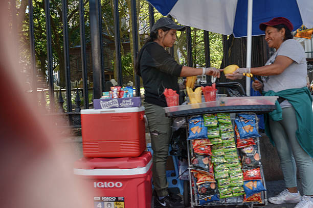 Smiling Fruit Vendor and her colleague in Downtown Manhattan NYC