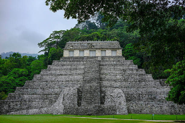 Ancient ruins of the Temple of the Skull surrounded by lush jungle Palenque, Mexico. Palenque was declared a world heritage site by UNESCO in 1987.