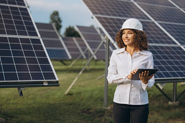 istock Female engineer working with digital tablet in solar power station 2233738411