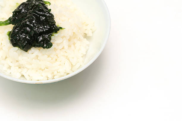 Simmered Seaweed Paste on a rice isolated on a white background.
