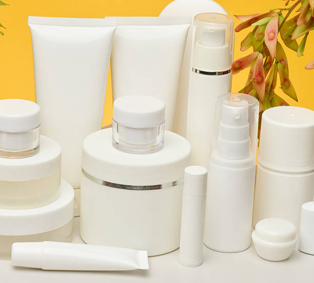 istock Set of white plastic cosmetic packaging without brand on yellow background. Container for beauty industry, skin care and advertising 2233739651