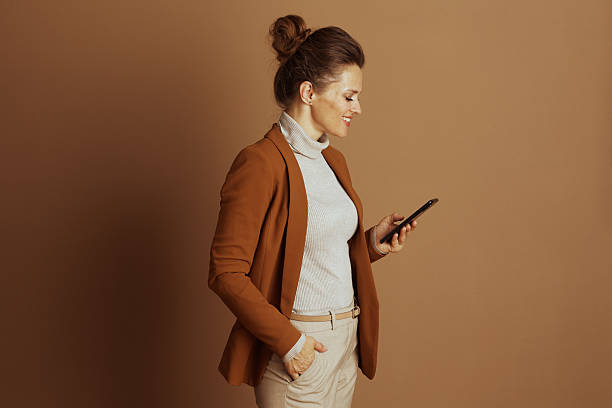 Businesswoman Browsing Smartphone in Profile