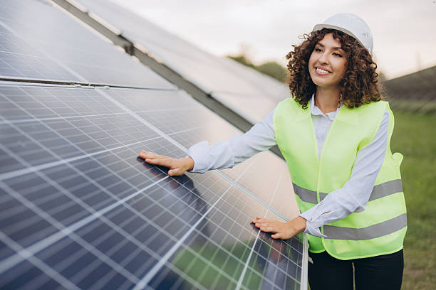 istock Female engineer inspecting solar panels in a power plant 2233741194