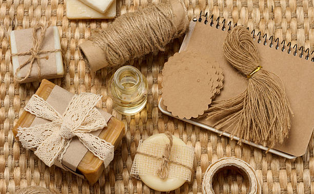 istock Handmade soap bars on marble stand and packaging items on table 2233742614