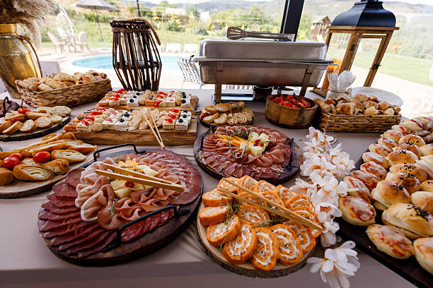 istock Delicious buffet spread featuring assorted meats, cheeses, and appetizers at a scenic outdoor location 2233742642