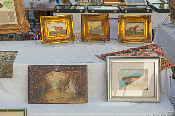 Cannes, France - January 28, 2018: Old Paintings Art for Sale at Antique Street Market in Town Centre Winter Day.