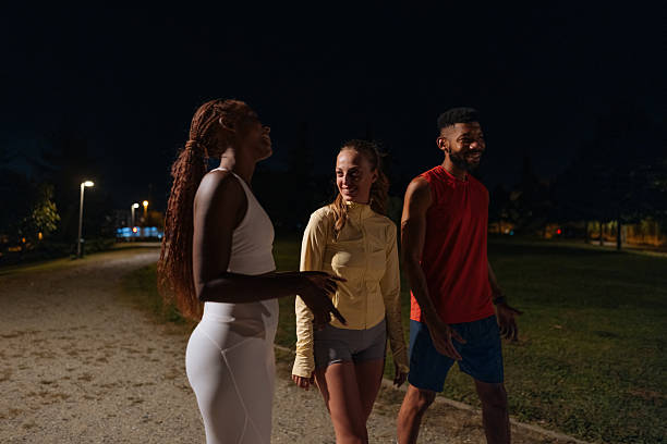 istock Fitness friends enjoying night walk after training session 2233746407