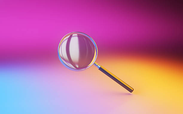 istock Shiny Magnifying Glass on Pink Yellow Blue Illuminated Infinite Background 2233746869