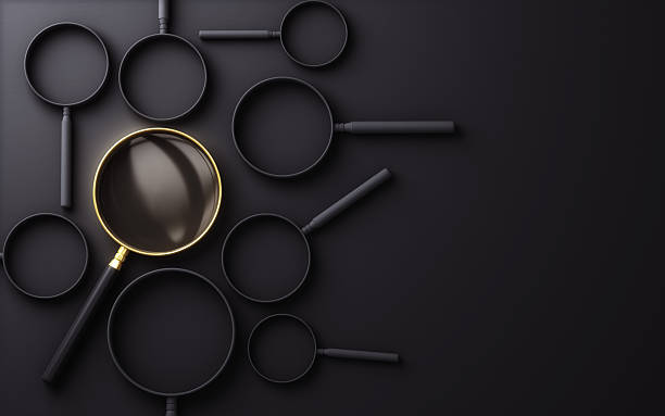 istock Gold Metallic Magnifier Selected Among Black Solid Magnifiers on Black Background 2233746871