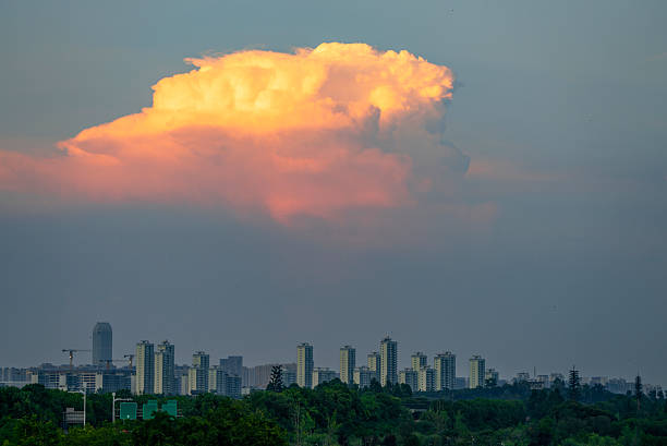 colorful cloud during sunset above city skyline