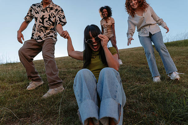 Young friends dancing in the park