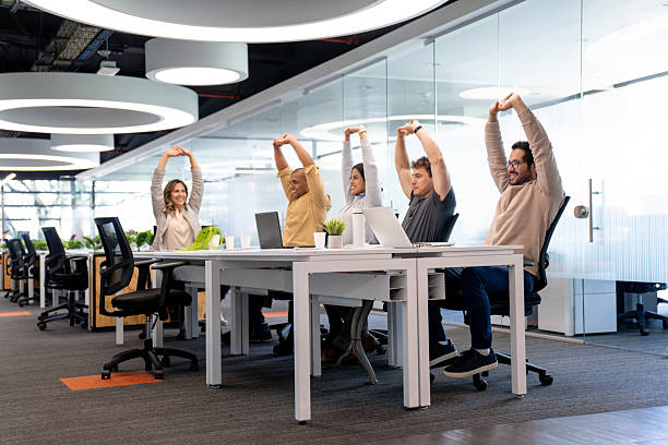 istock Group of business people stretching during an active pause at the office 2233753774