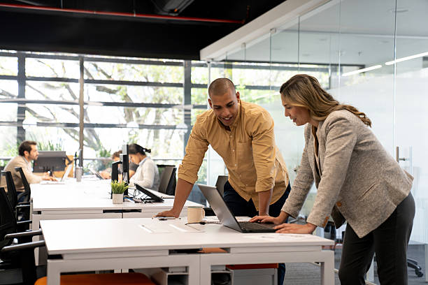 istock Business team brainstorming at a coworking office while using a laptop 2233753860