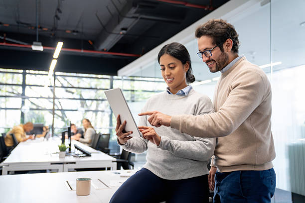 istock Business team working together at the office using a digital tablet 2233753870