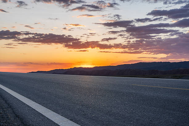 istock Empty asphalt road and mountain with beautiful sky clouds landscape at sunset 2233760458