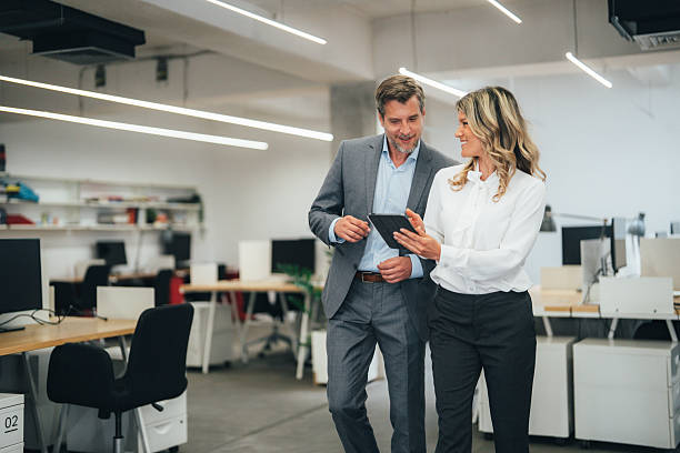 istock Business colleagues talking in the office 2233762063
