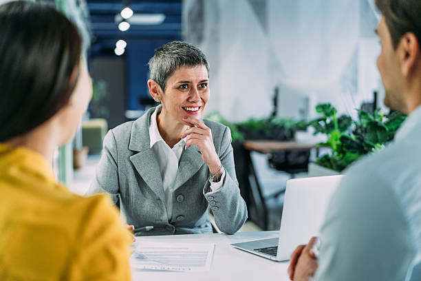 istock Group of business persons talking in the office. 2233762219