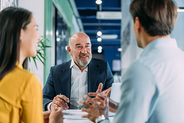 istock Group of business persons talking in the office. 2233762220
