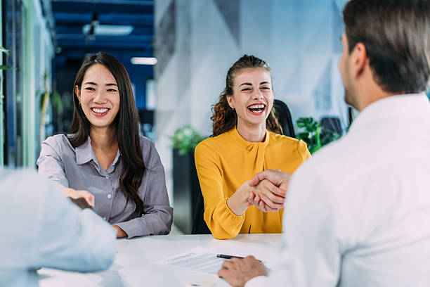 istock Businesspeople shaking hands across the table. 2233762306